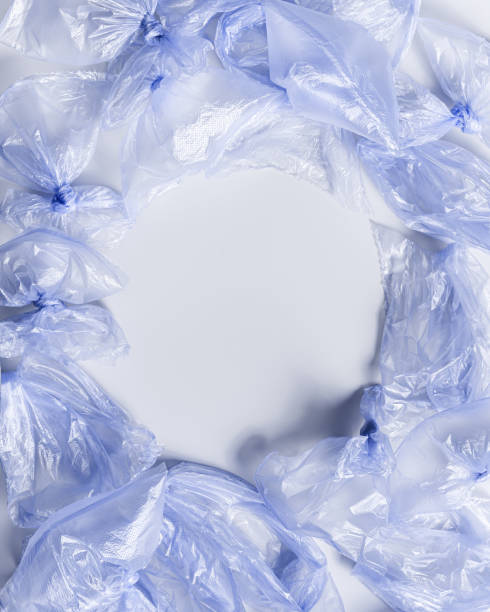 istock Plastic free environment protection concept. Empty used plastic bags,  monochrome frame background, copy space. Aesthetic top view blue disposable polyethylene packet. Plastic bag free day 1492060234
