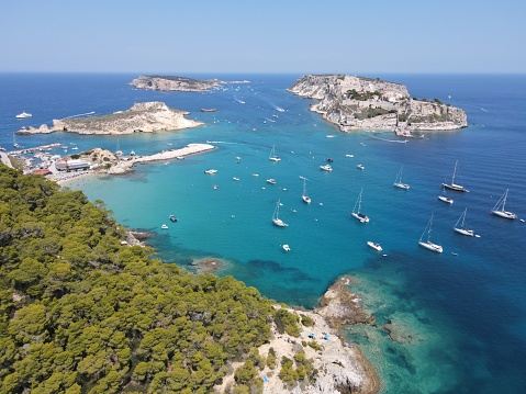 Aerial vie of Porto Timoni beach in Corfu. Located in the Ionian Sea of Greece the idyllic beach is surround by crystal clear turquoise water.