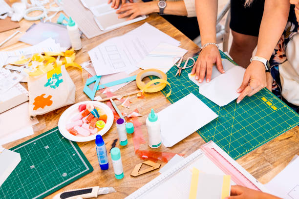 istock Scrap Booking Workshop. Close-up of a woman working on paper. 1492063682