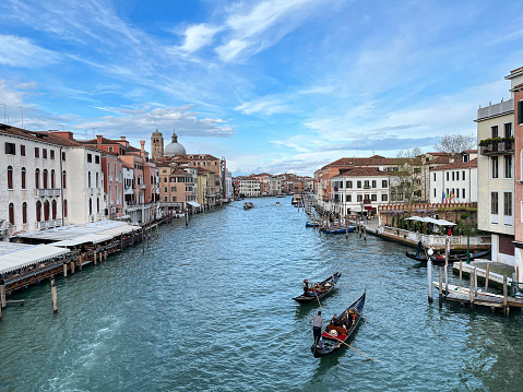 Cityscape of Venice, Italy. Canale Grande (Grand Canal), gondolas and typical architecture seen on a clear day.