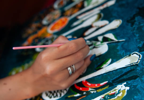 istock Hands painting with brush and acrylic paint 1492065566