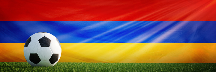 Creative football soccer ball on the flag of Armenia, Football background.
