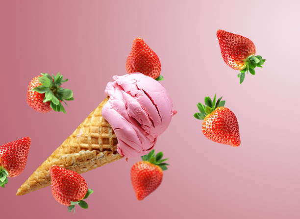 istock Strawberry ice cream in a waffle cone with falling fresh berries. 1492075387