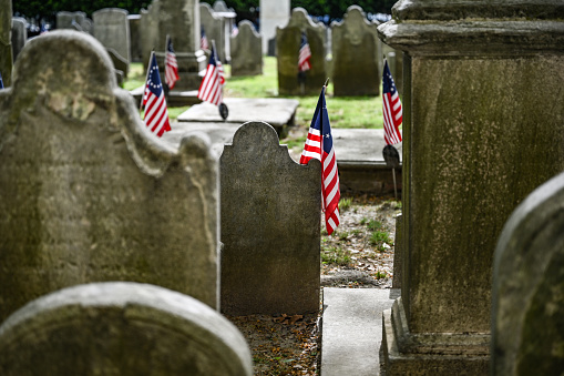 Historic cemetery for confederate soldiers in Philadelphia city. Confederate flags are placed on memorial event for the fallen. Can be used for American civil war / American history storytelling.