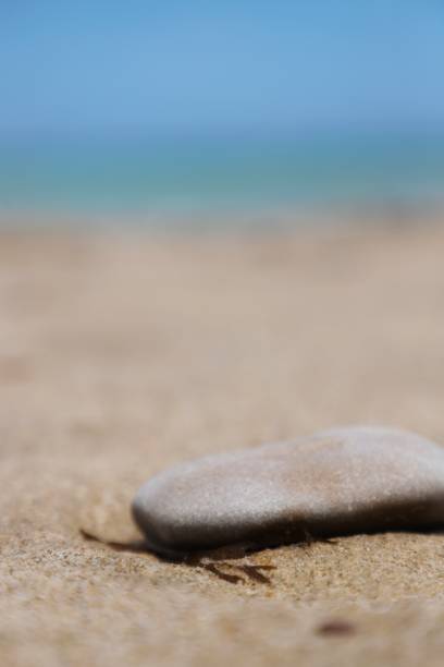 istock closeup of waves with white foam on the beach 1492078853