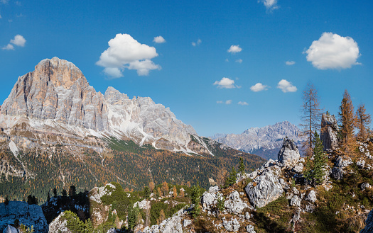 Sunny picturesque autumn alpine Dolomites rocky  mountain view from hiking path from Giau Pass to Cinque Torri (Five pillars or towers) rock famous formation, Sudtirol, Italy.