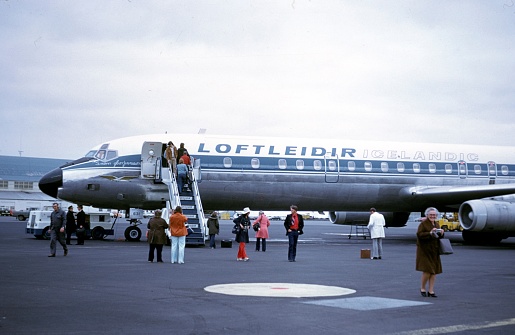 Reykjavik, Iceland, 1974. Stopover at Reykjavik Airport on an Atlantic flight. Also: passengers and airplane.
