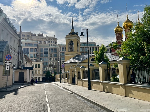Moscow street with administrative and residential building and church