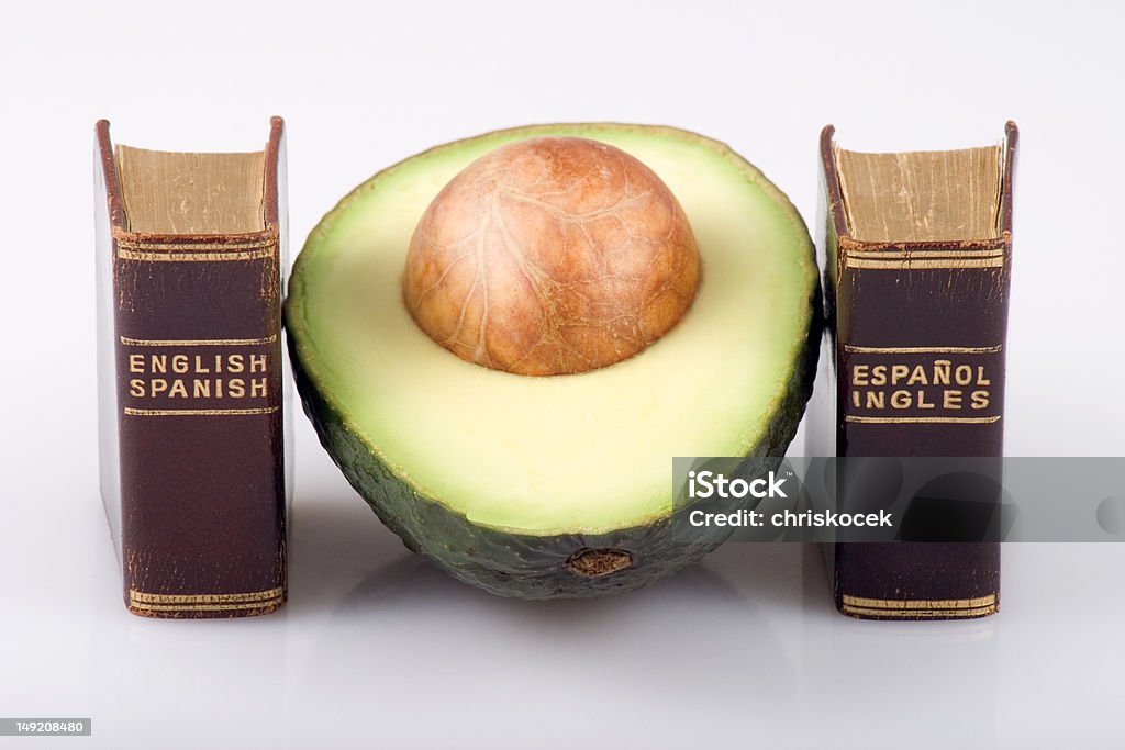 Avocado e dizionari - Foto stock royalty-free di Traduzione