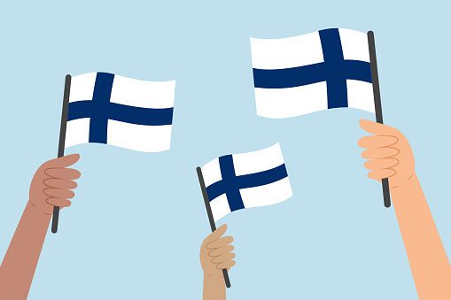 Diverse hands raising flags of Finland. Vector illustration of Finnish flags in flat style on blue background.