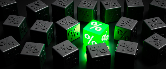 Black and green luminous dice with percentage signs - sale or bargain concept - 3D illustration