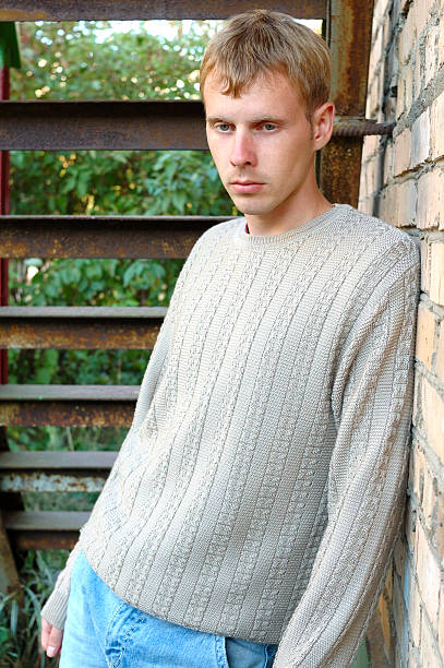 istock Young stylish man stay under stairs near brick wall. 149208756