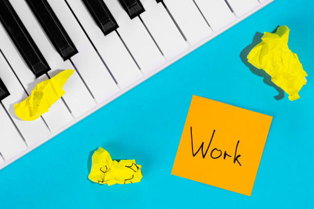 istock Piano and paper reminder with word Work on blue background. 1492088252