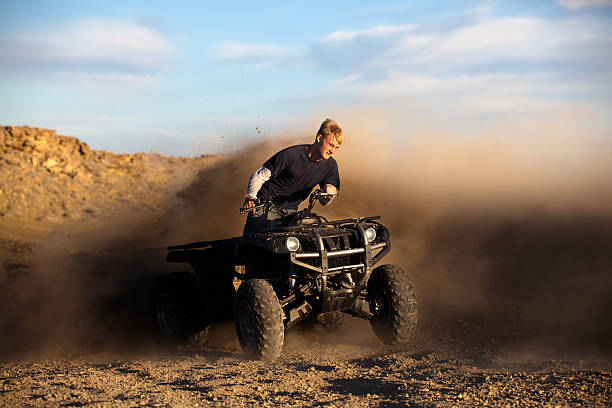 istock riding ATV - teen on quad 149208855