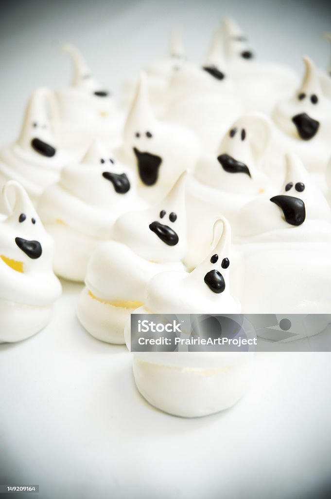 Ghost Meringues Halloween meringue cookies, decorated to look like ghosts; vignette, shallow depth of field Ghost Stock Photo