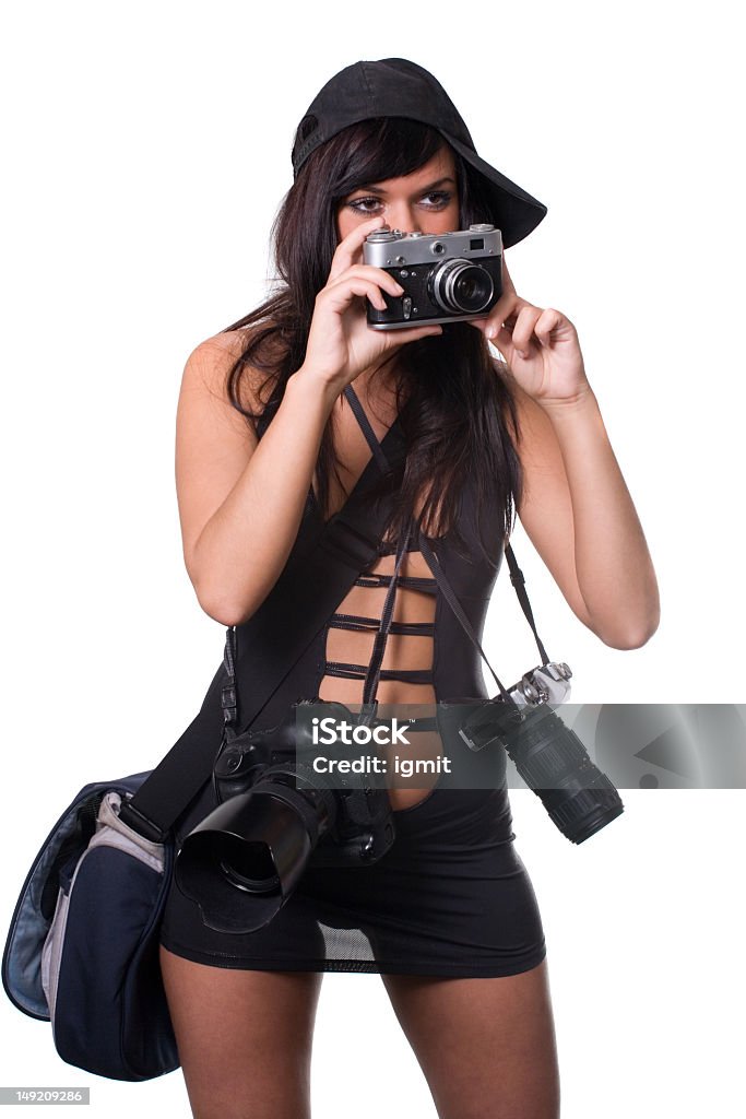 Photographer The beautiful girl looks forward, holds an old camera in hands Adult Stock Photo