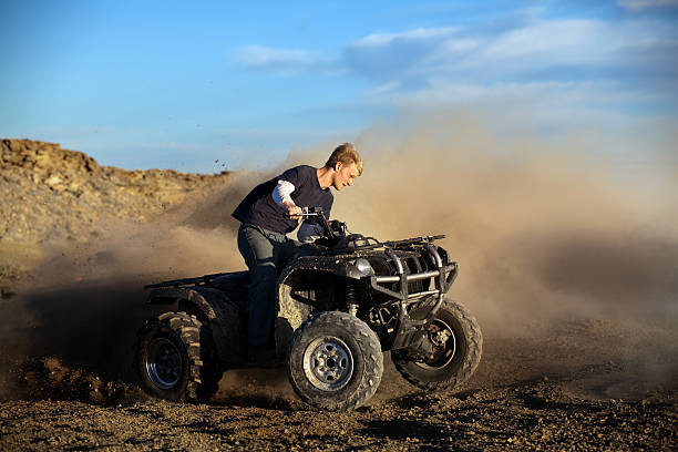 istock teen on quad four wheeler 149209296