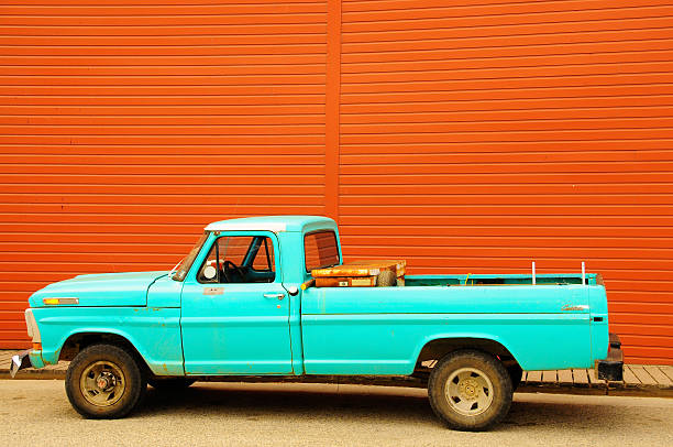 istock Old Blue truck by a red wall 149209523