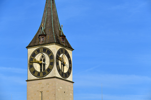 Zurich, Switzerland: clock tower of St. Peter Church, St. one of the three old town churches that characterize the silhouette of Zurich. It is located on a hill in the old town on the left bank near the Lindenhof, where the Roman settlement of Turicum and the imperial palace were located. The tower is older than today's church and already had its current shape around 1500.
