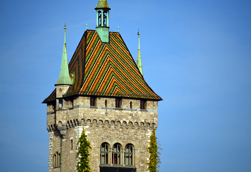 Zurich, Switzerland: tower with chevron pattern roof of the Swiss National Museum (Landsmuseum Zürich), it opened in1898 and it is the most visited historical museum in Switzerland. Housed in a fortress-like building designed by Gustav Gull.