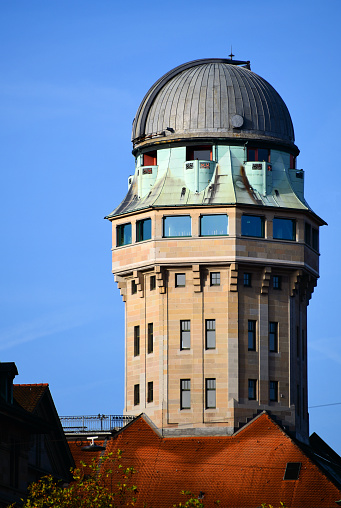 Top of the main entrance of the Leipzig City hall with the St. Trinity Catholic Church looking to it