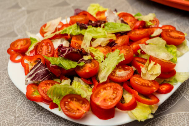 istock Healthy colorful mix vegetables on white plate. Diet menu 1492102877