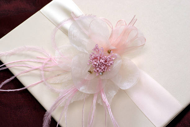 istock Flower on white card with ribbon 149210289