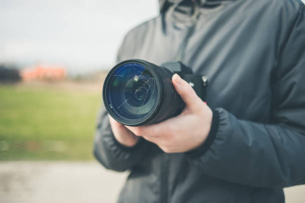 istock Broken lens filter on DSLR camera. Closeup, cracked photo-filter 1492102890