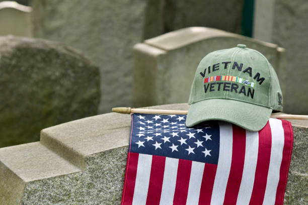 istock Vietnam Veterans cap on flag and grave marker 1492108591