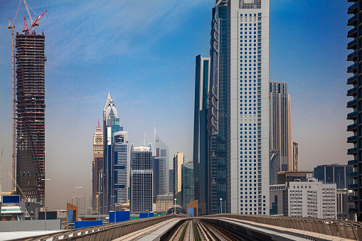 Modern skyscrapers along the metro line in Dubai, UAE