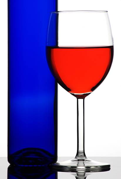 Wineglass with red liquid stock photo