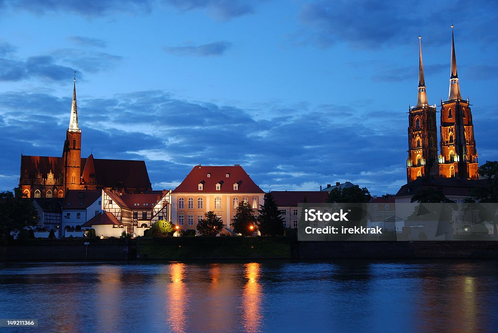 Wroclaw by night Wroclaw, Ostrow Tumski,Poland. Illuminated view from a bank of the Odra river. Church Stock Photo