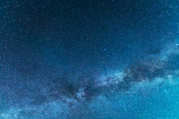 istock Beautiful starry night. Bright Milky Way galaxy sky. Astronomical background. 1492119510