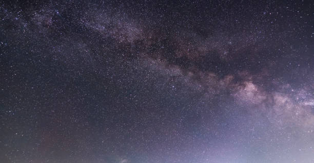 istock Beautiful starry night. Bright Milky Way galaxy sky. Astronomical background. 1492119664
