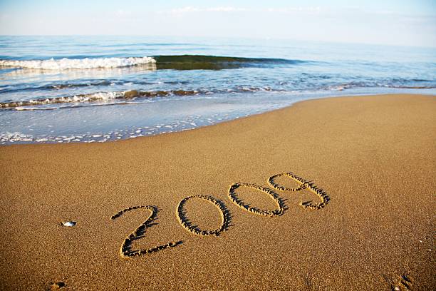 istock Number 2009 written in the sand 149213244