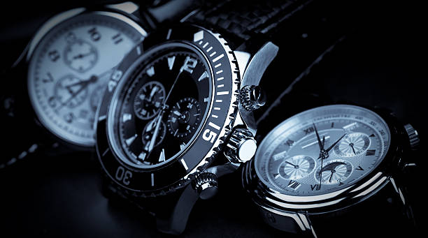 Three wrist watches displayed beside one another  wristwatches on a black wristwatch photos stock pictures, royalty-free photos & images