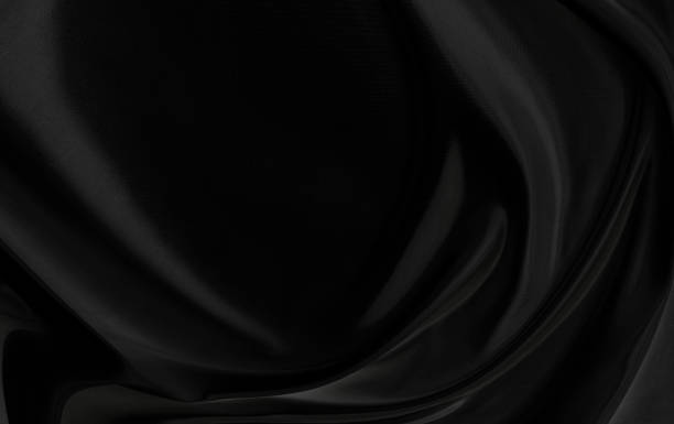 istock Black gray satin dark fabric texture luxurious shiny that is abstract silk cloth background with patterns soft waves blur beautiful. 1492136972