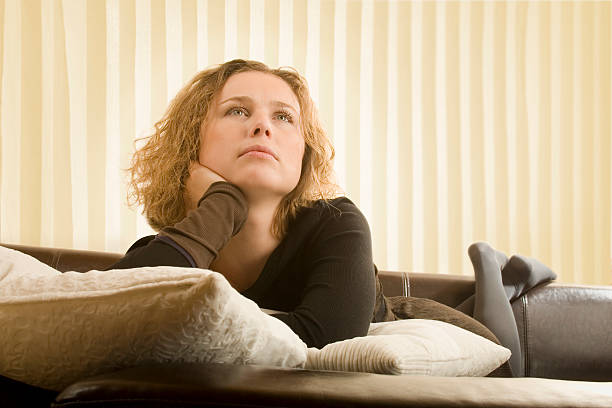 istock Beautiful young woman, relaxed on the couch 149213920