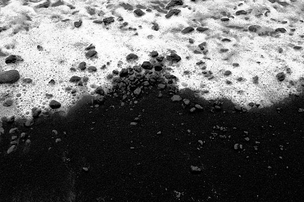 Black Beach with foam stock photo