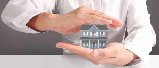 istock House Residential Structure in hand ,business home idea 1492151695