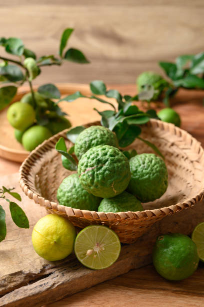 istock Kaffir lime and lime fruit on wooden background 1492158215