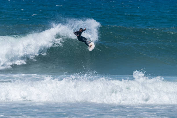 istock Surfer riding waves in Furadouro Beach 1492165744