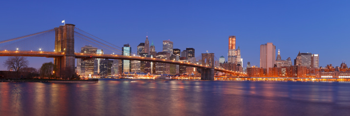 Brooklyn Bridge and Lower Manhattan as seen from Brooklyn Bridge Park at dawn.