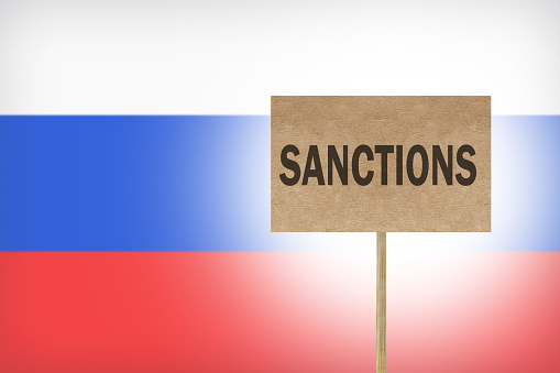 poster with message economic and political sanctions for Russia