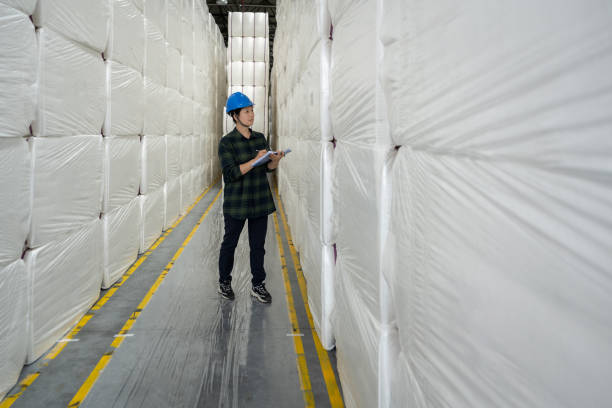 istock A female warehouse worker works in a non-woven fabric warehouse 1492170390