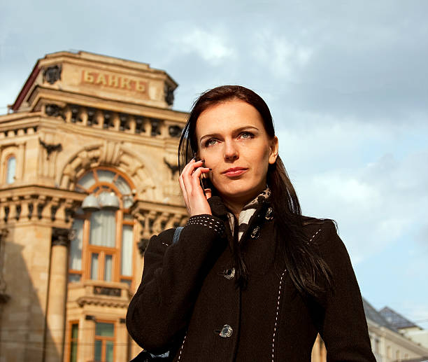 Young business woman talking in mobile phone stock photo