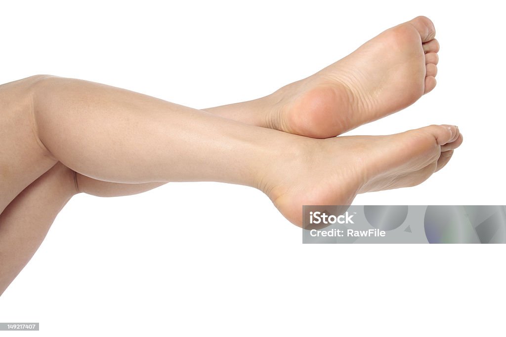Donna gambe e piedi su bianco - Foto stock royalty-free di Adulto