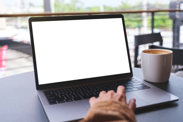 istock Mockup image of a woman using and working on laptop computer with blank white desktop screen 1492180090