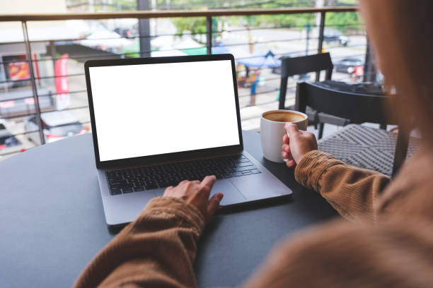istock Mockup image of a woman using and working on laptop computer with blank white desktop screen 1492180091