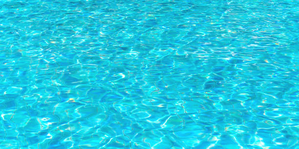 istock Water swimming pool background with texture surface pattern of blue turquoise ripple wavy water reflection of natural aqua wave on the outdoor summer holiday vacation pool 1492181635